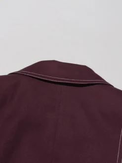 Blazer long à coutures contrastées pour femme revers cranté double boutonnage longueur maxi