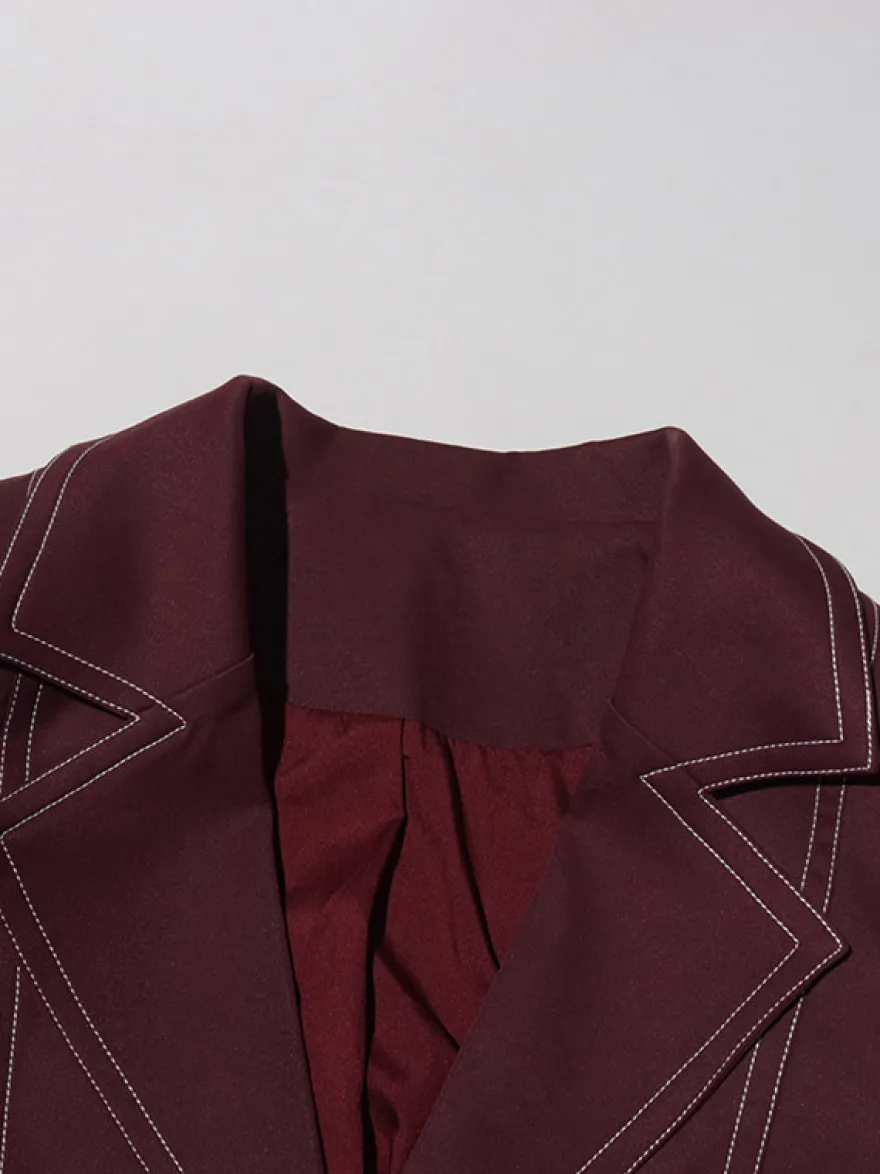 Blazer long à coutures contrastées pour femme revers cranté double boutonnage longueur maxi