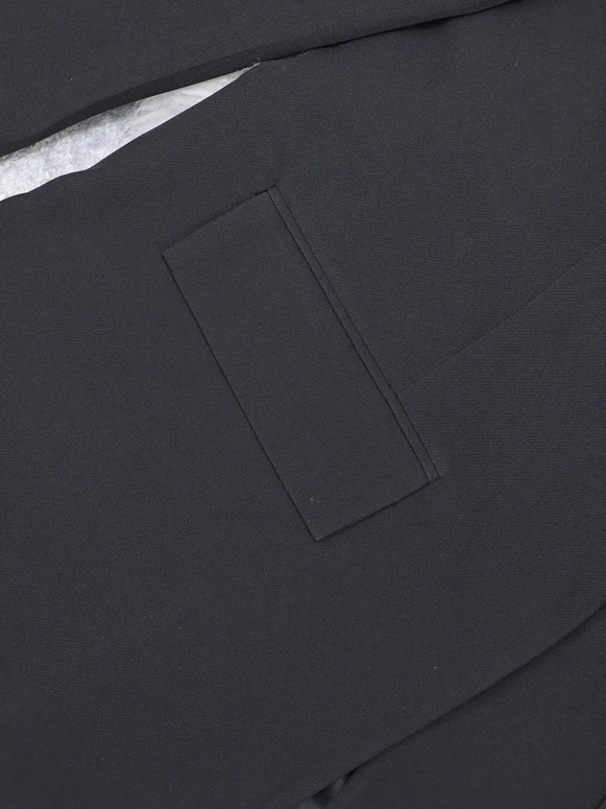 Blazer long à devant ouvert pour femme coupe ample et décontractée avec revers. Veste de tailleur noire décontractée.