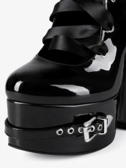 Bottes noires hautes à plateforme et boucle lacets et talons épais