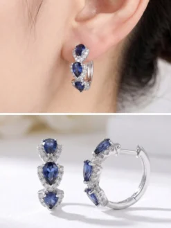 Boucles d'oreilles blanches pour adulte style western décontracté design géométrique en forme de goutte.
