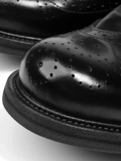 Chaussures de ville pour hommes style brogue bout rond lacets en cuir véritable.