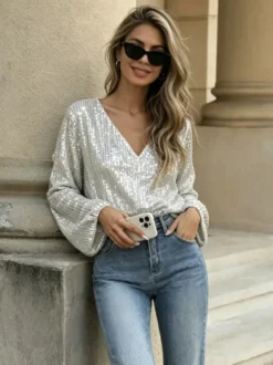 Chemise à paillettes argentées oversize pour femme col en V manches longues style lanterne idéale pour les soirées.