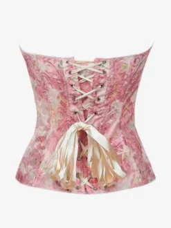 Corset bustier rose en dentelle florale sans bretelles à baleines en acier gainant la taille.