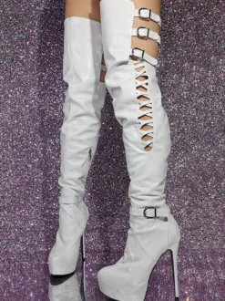 Cuissardes sexy noires à plateforme découpée sur les bottes au genou