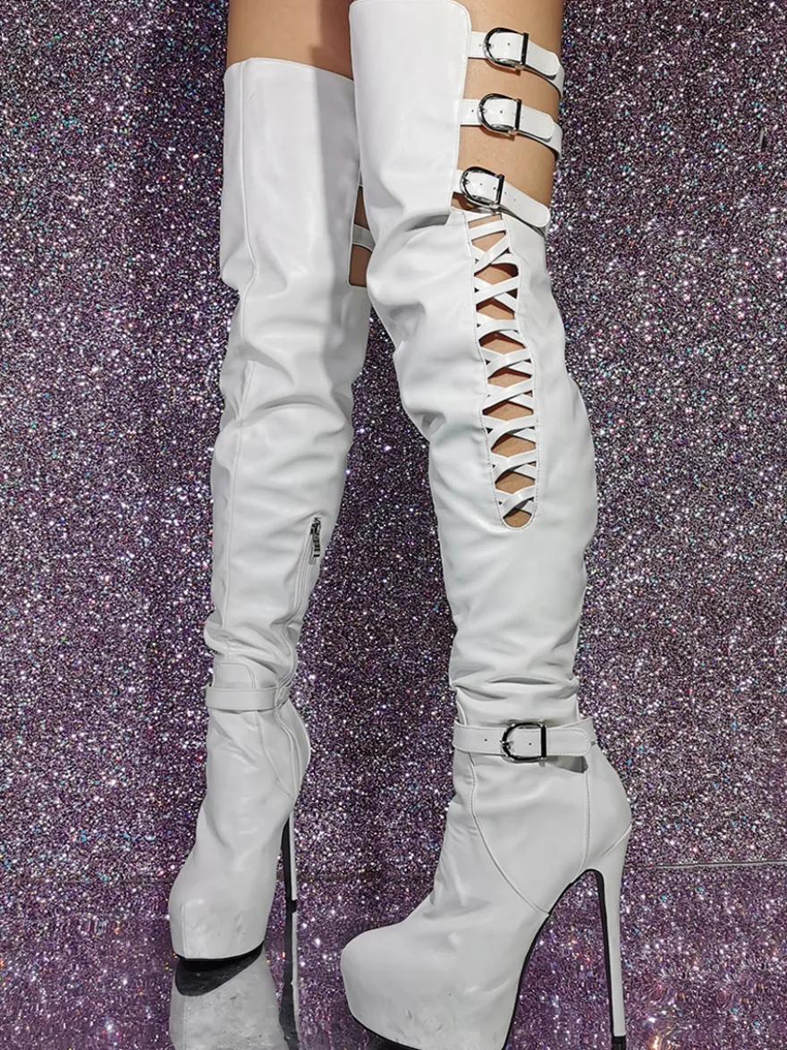 Cuissardes sexy noires à plateforme découpée sur les bottes au genou