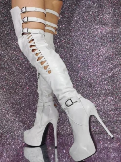 Cuissardes sexy noires à plateforme découpée sur les bottes au genou