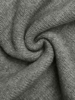 Ensemble deux pièces : top court sans manches à col V en maille et jupe taille haute. Tenue deux pièces pour femme.