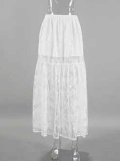Jupe longue à volants en dentelle florale transparente à taille élastique noire et blanche transparente.