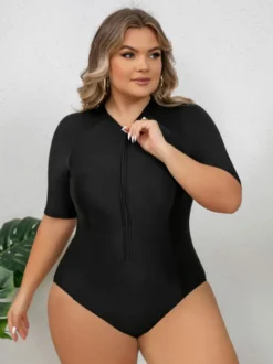 Maillot de bain anti-UV noir uni grande taille à manches mi-longues et fermeture éclair sur le devant