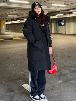 Manteau Matelassé Long Femme Comme Doudoune à Capuche avec Manches Longues à Zip avec Poches Unicolore Manteau Femme