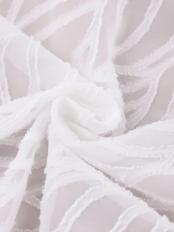 Mini-robe en jacquard à col en V et manches longues pour l'été 2026