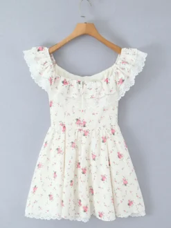 Mini-robe fleurie à épaules dénudées et nœud pour l'été 2026