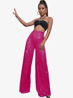 Pantalon palazzo à sequins taille haute et jambes larges style clubwear.