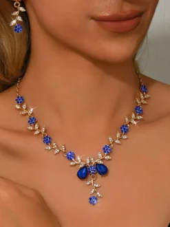 Parure de bijoux de mariage tendance élégante en métal et perles d'imitation.