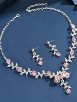 Parure de bijoux de mariage tendance élégante en métal et perles d'imitation.