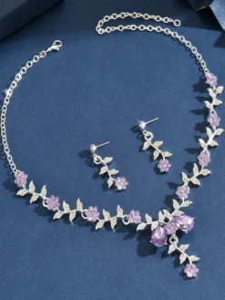 Parure de bijoux de mariage tendance élégante en métal et perles d'imitation.