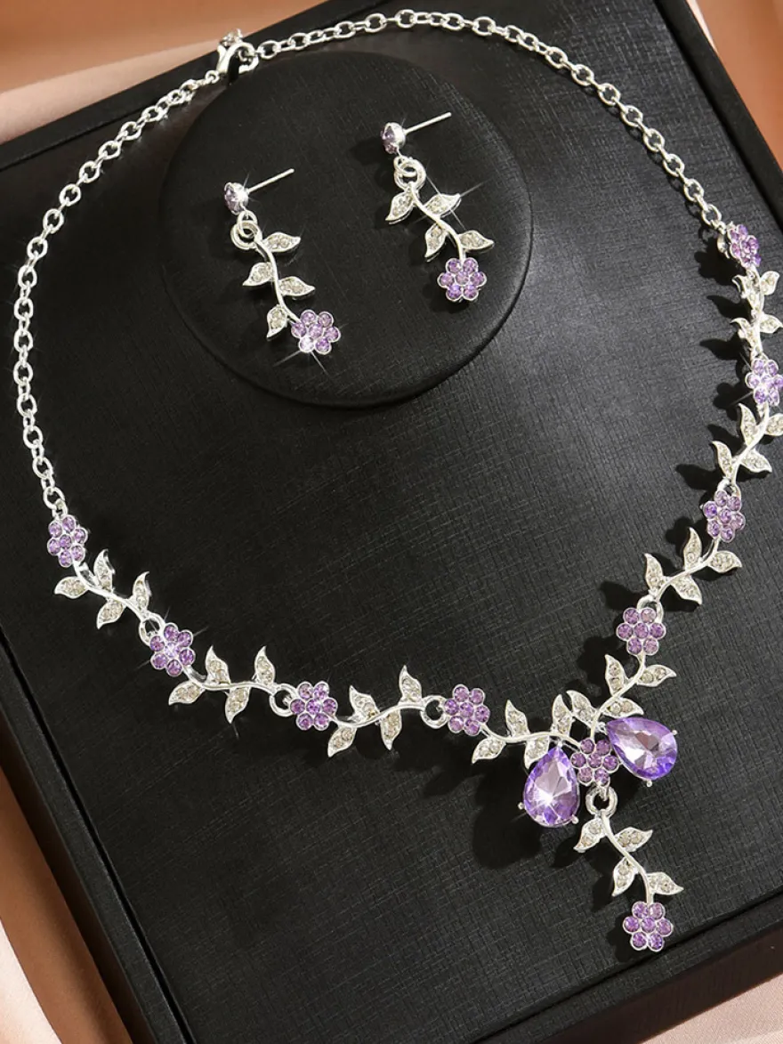 Parure de bijoux de mariage tendance élégante en métal et perles d'imitation.