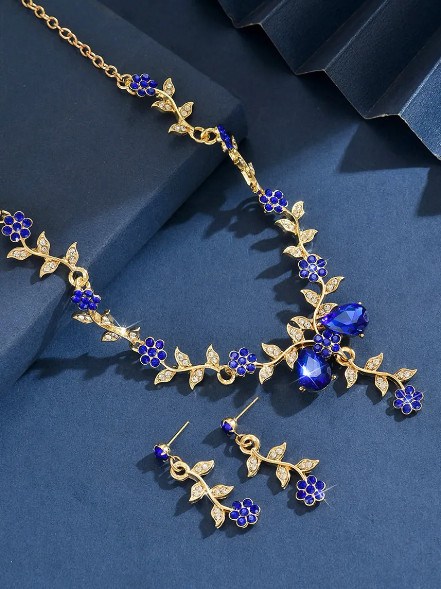 Parure de bijoux de mariage tendance élégante en métal et perles d'imitation.