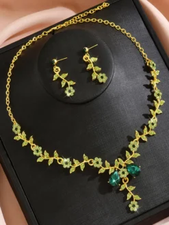 Parure de bijoux de mariage tendance élégante en métal et perles d'imitation.