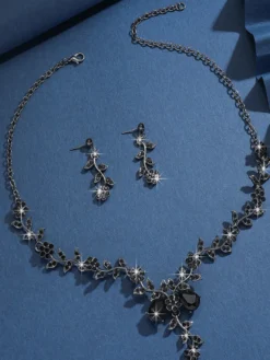 Parure de bijoux de mariage tendance élégante en métal et perles d'imitation.
