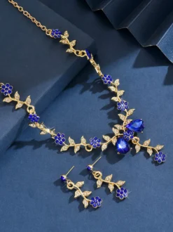 Parure de bijoux de mariage tendance élégante en métal et perles d'imitation.