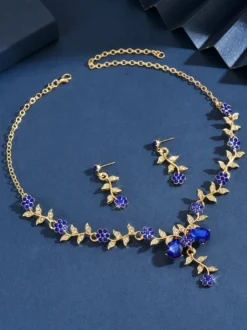 Parure de bijoux de mariage tendance élégante en métal et perles d'imitation.