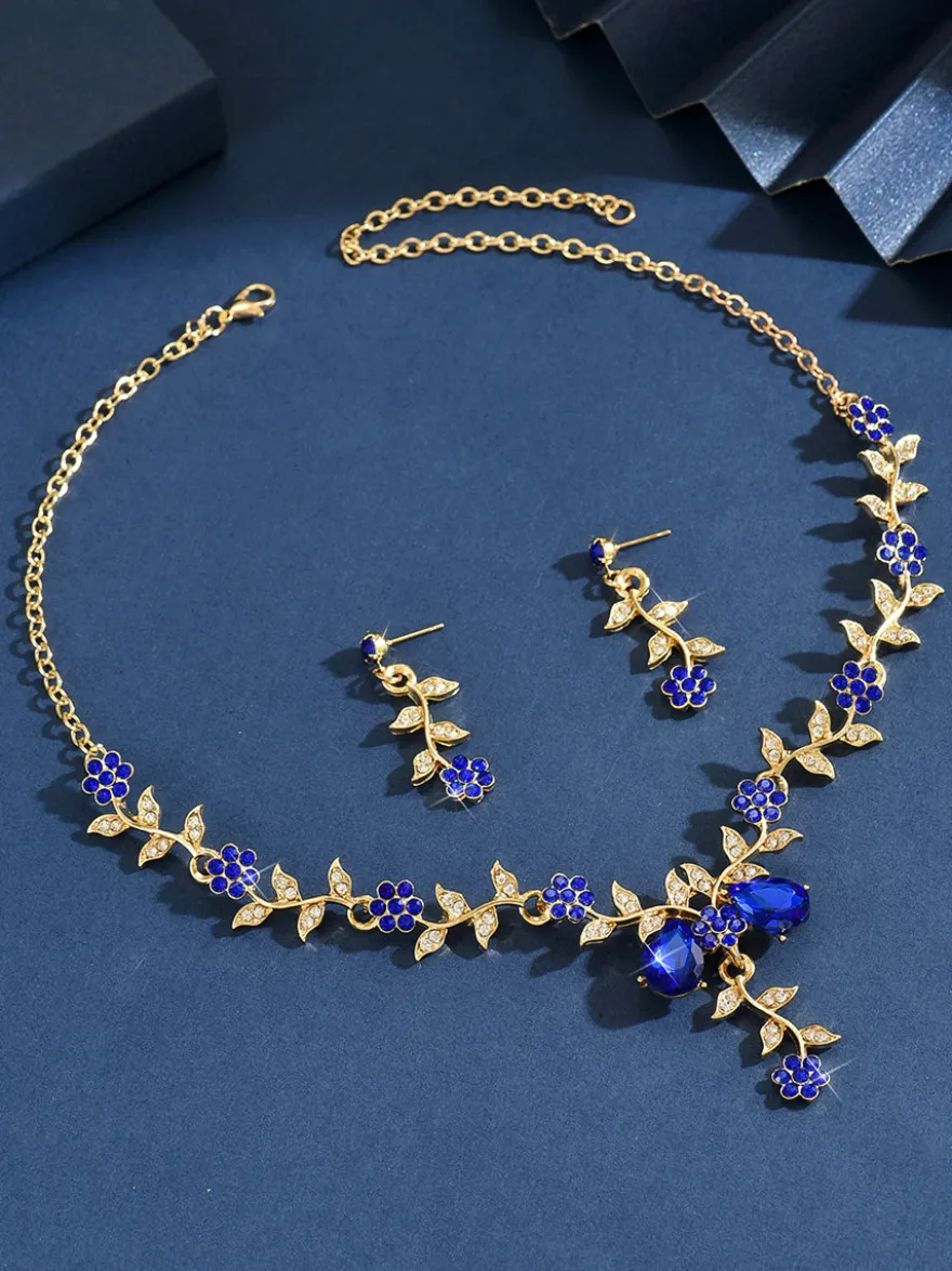 Parure de bijoux de mariage tendance élégante en métal et perles d'imitation.
