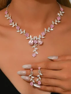 Parure de bijoux de mariage tendance élégante en métal et perles d'imitation.