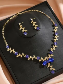 Parure de bijoux de mariage tendance élégante en métal et perles d'imitation.