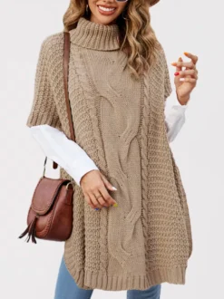 Pull ample décontracté à col montant en maille style cape sans manches en fil épais torsadé.