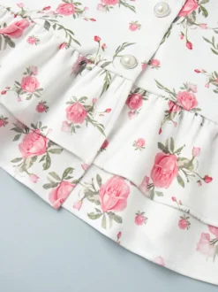 Robe courte à imprimé floral manches bouffantes col Claudine et lacets dans le dos été 2026