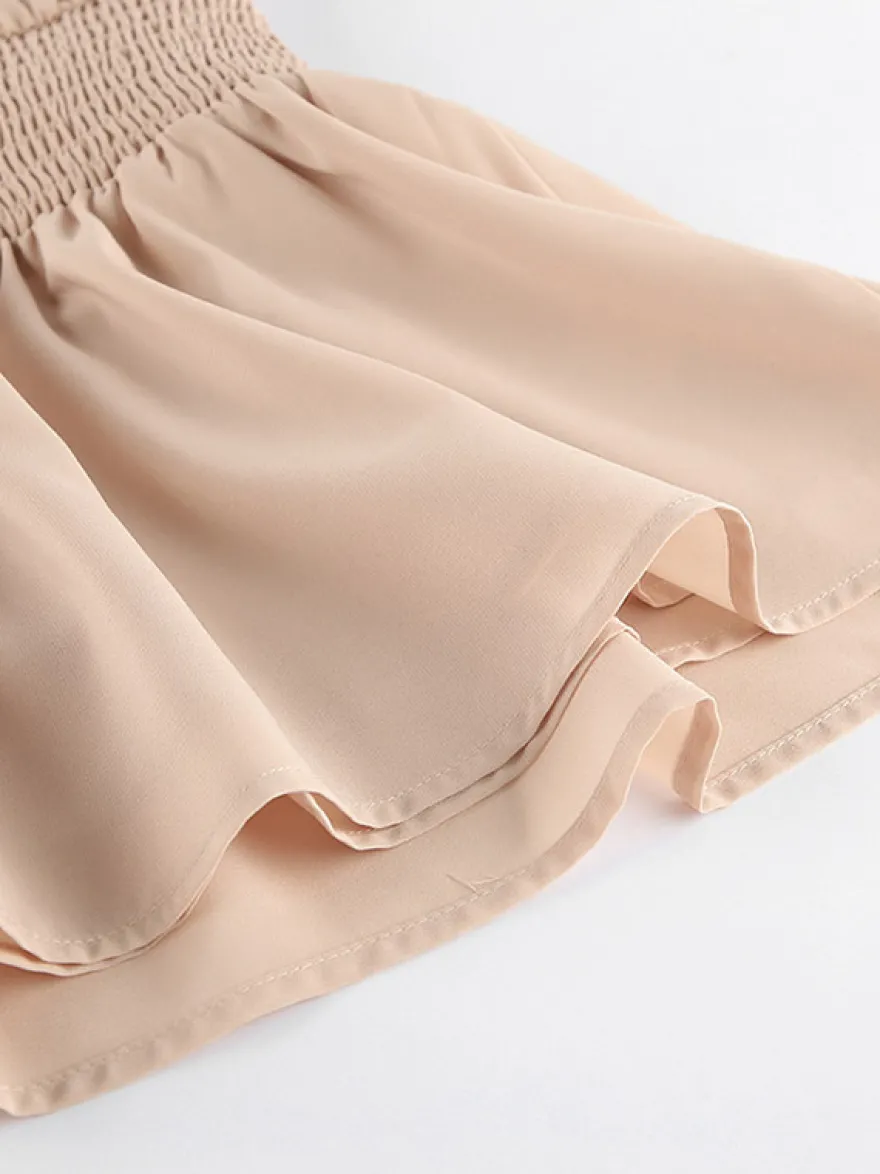 Robe courte kaki sans manches dos nu col montant taille naturelle