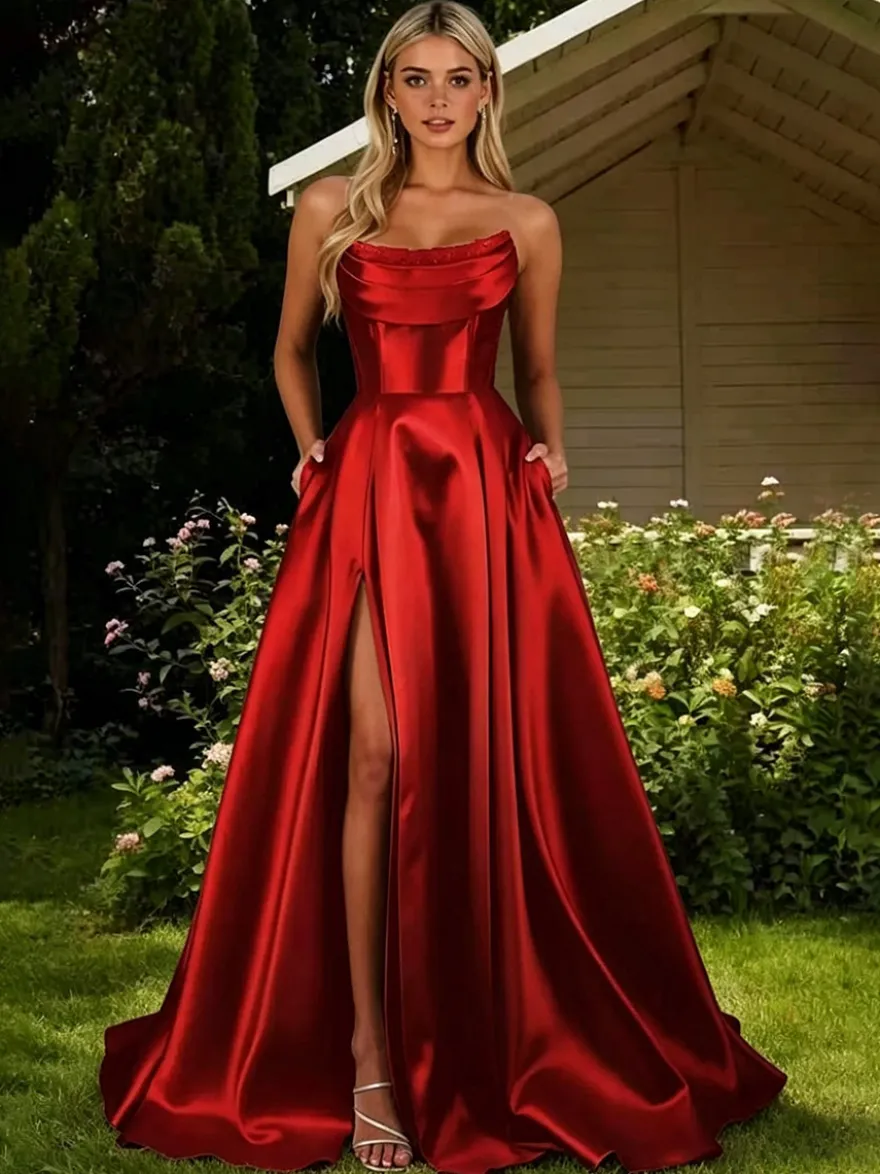 Robe de bal en satin décolleté travaillé coupe trapèze sans manches plissée