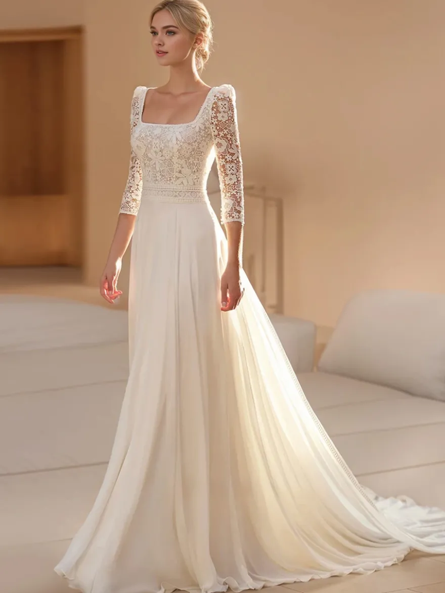 Robe de mariée bohème en mousseline découpée coupe trapèze avec traîne taille naturelle dos nu manches 3/4 col carré couleur ivoire