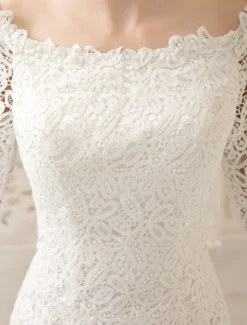 Robe de mariée courte col bateau manche longue zip sur dos en dentelle