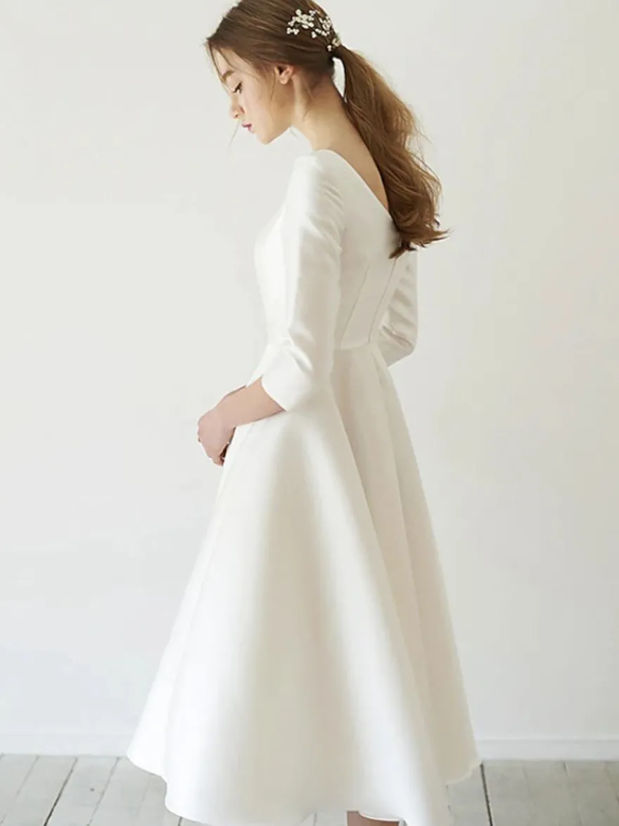 Robe de mariée courte col rond demi manche zip sur dos