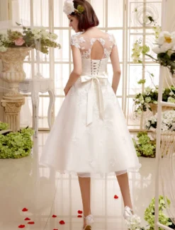 Robe de mariée courte en organza manche courte laçage sur dos longueur au genou Robe de mariage