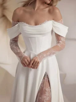 Robe de mariée dentelle Ivoire Cou original manches longues détail zip Robes de mariée