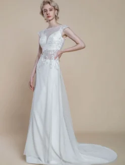 Robe de mariée deux pièces en dentelle décolleté illusion fourreau avec traîne fermeture éclair manches courtes longueur 30 cm ivoire