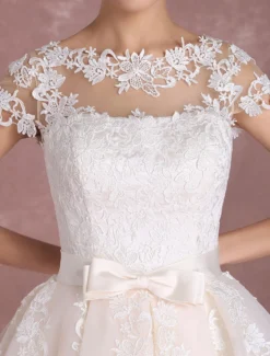 Robe de mariée vintage courte col rond manche courte boutonné sur dos