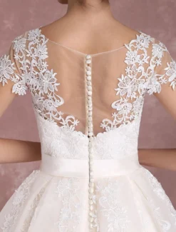 Robe de mariée vintage courte col rond manche courte boutonné sur dos