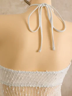 Robe de plage midi dos nu à boutons soleil en maille ajourée transparente
