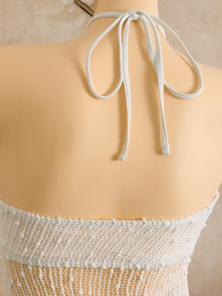 Robe de plage midi dos nu à boutons soleil en maille ajourée transparente