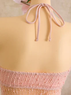 Robe de plage midi dos nu à boutons soleil en maille ajourée transparente