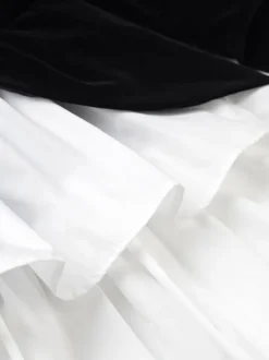 Robe de soirée chic bicolore noire à volants mini-robe deux-pièces à manches longues.