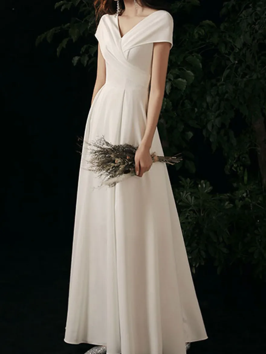 Robe de soirée trapèze col en V tissu satiné longueur au sol