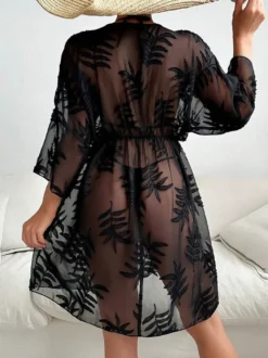 Robe de vacances chic noire à manches 3/4 et col en V transparente et sculptante