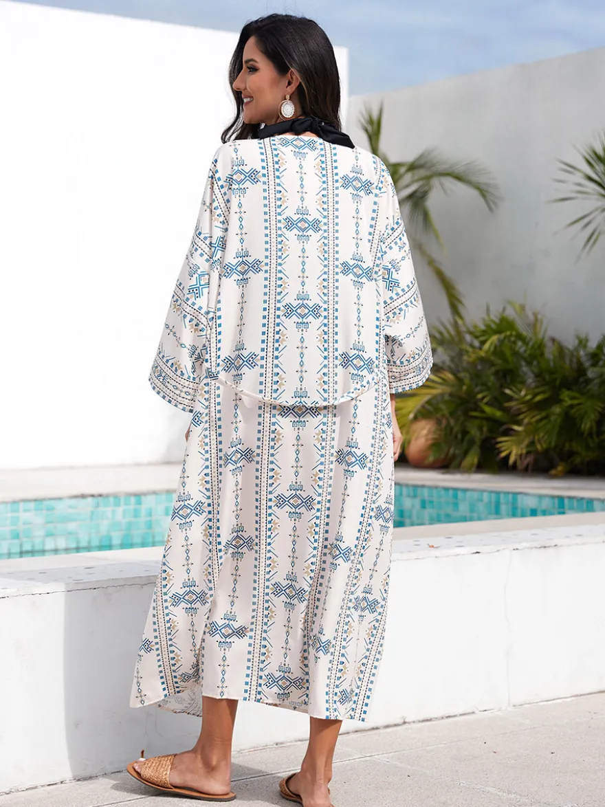 Robe de vacances imprimée bleu ciel clair à manches longues et ceinture à volants