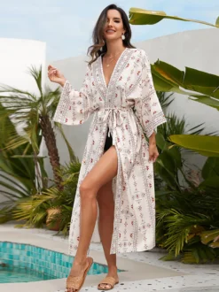 Robe de vacances imprimée bleu ciel clair à manches longues et ceinture à volants